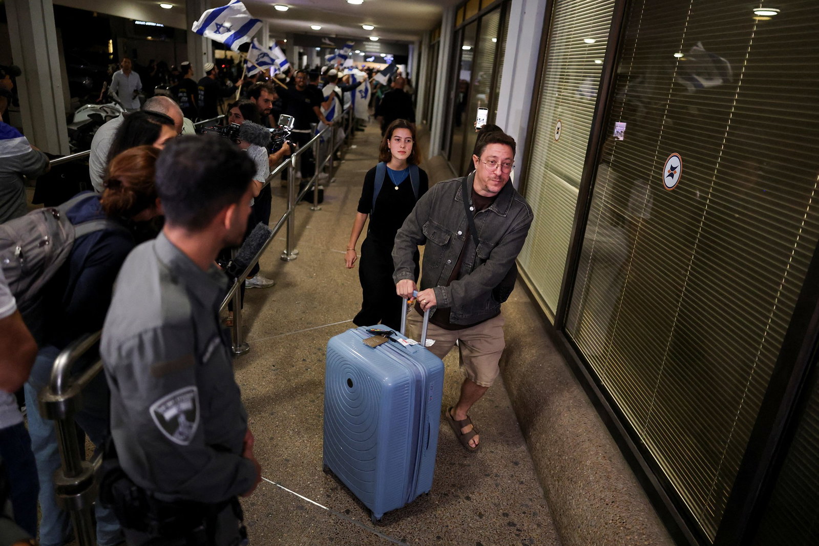 Passengers mobbed by crowds on their arrival.