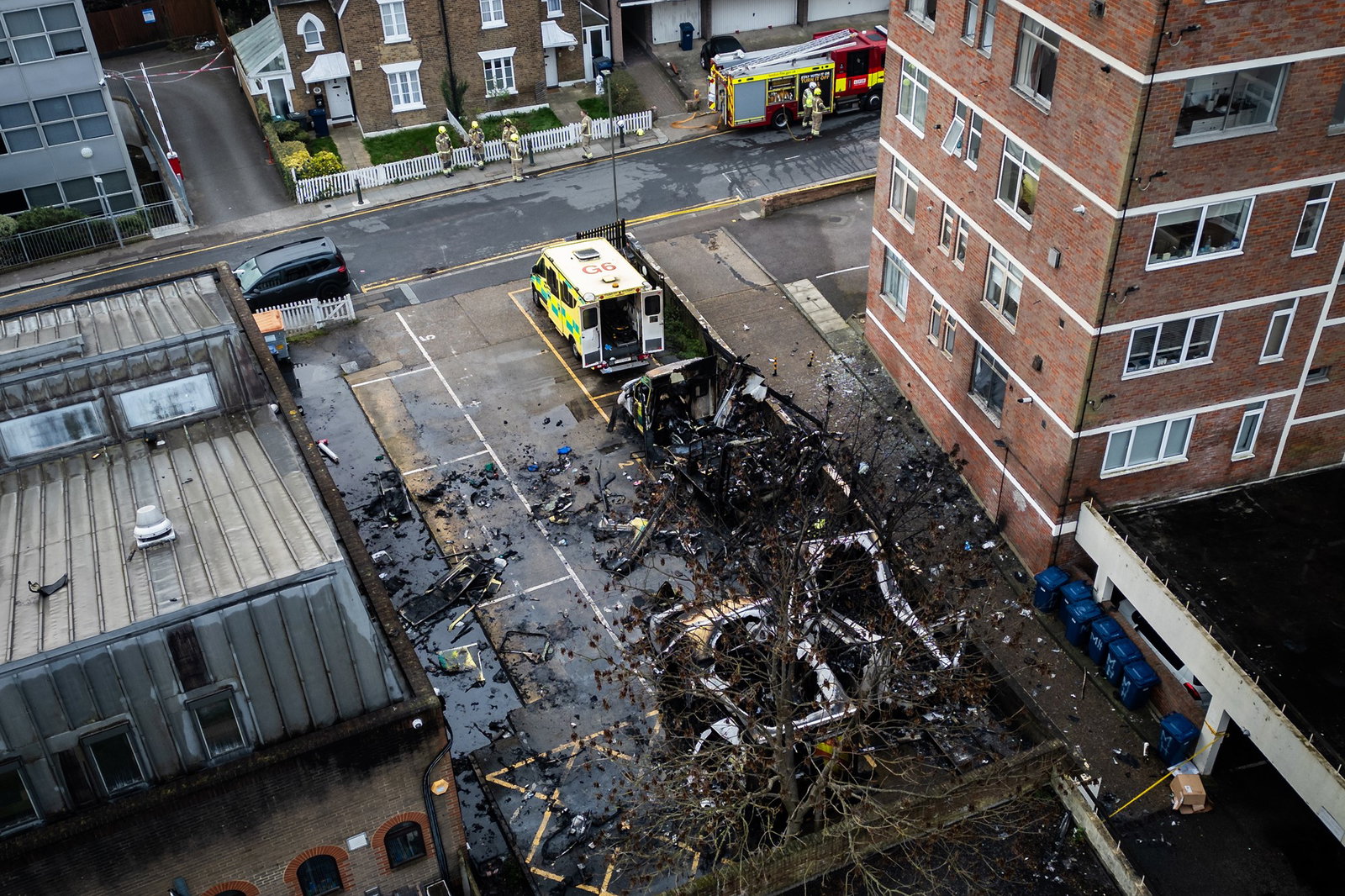  An aerial view as fire services continue to monitor the scene after four Hatzola ambulances were set on fire overnight next to Machzike Hadath Synagogue