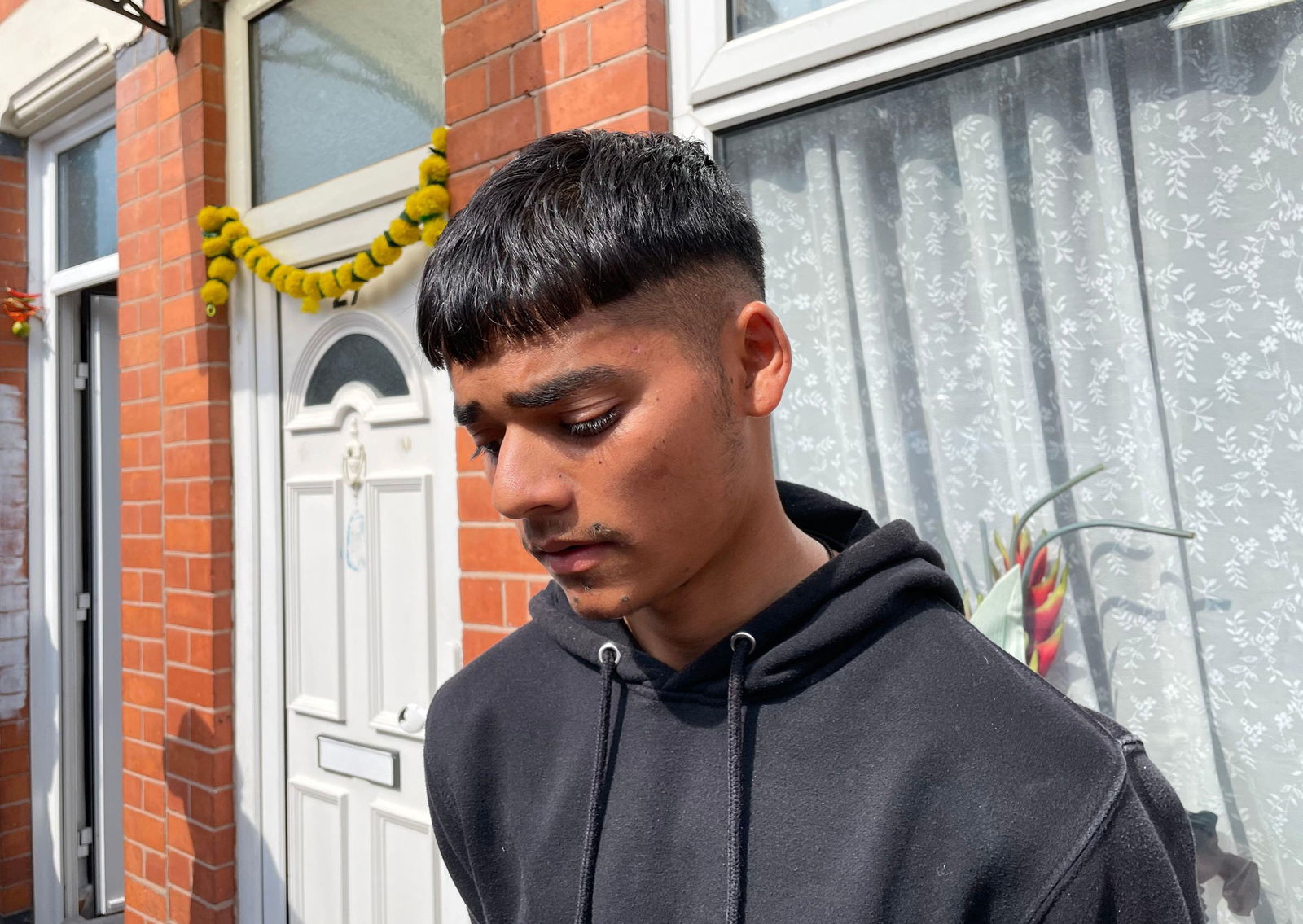 Hiren Kantilal, 19, the cousin of Viswash Kumar Ramesh, the British survivor of the Air India plane crash, speaking outside the family home in Leicester