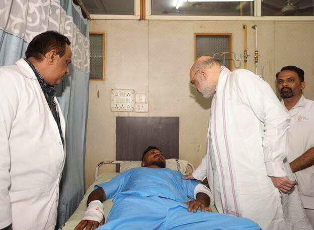 Home Affairs shows Home Affairs Minister Amit Shah meeting British plane crash survivor Vishwash Kumar Ramesh, 40, at a hospital in Ahmedabad