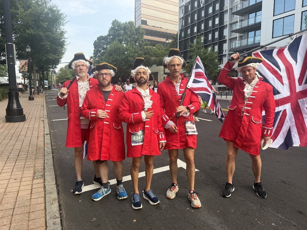 A group of redcoats, led by Micah Wedemeyer (center right), railed along Peachtree on Saturday.