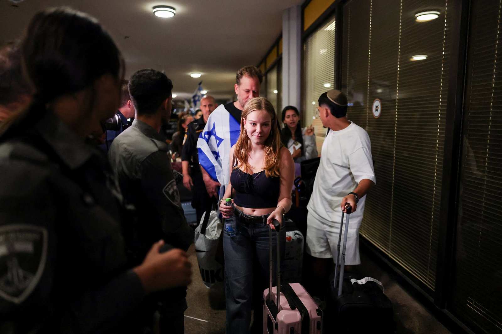 Passengers mobbed by crowds on their arrival.
