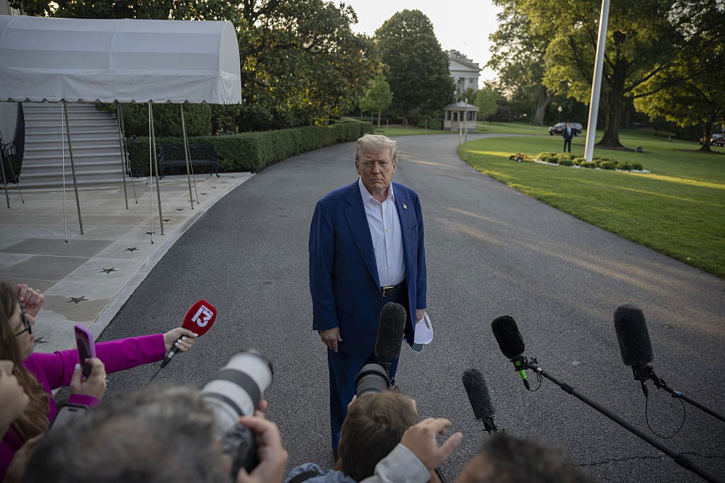 Donald Trump speaks to press before his departure at the White House to route The Hague, Netherlands