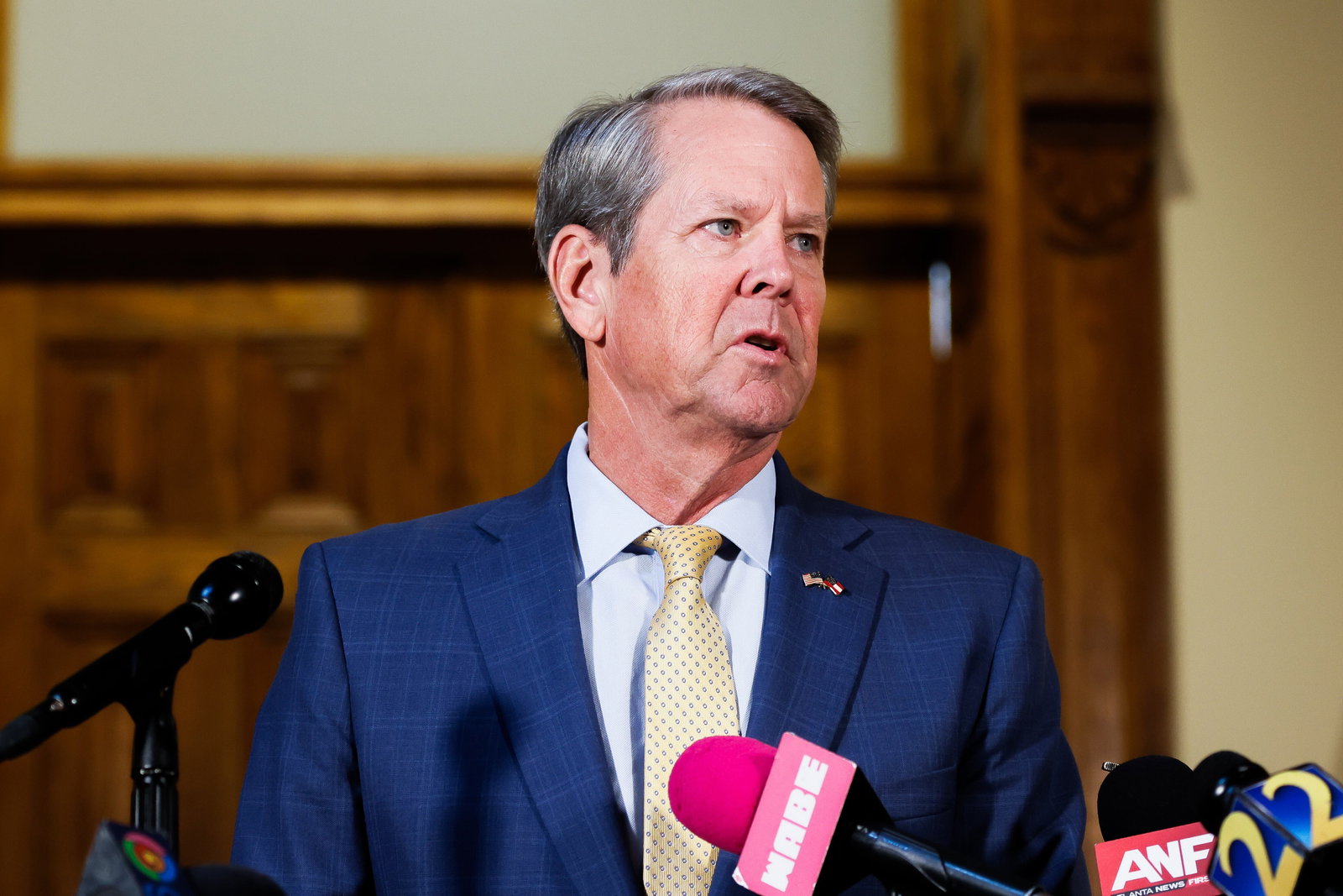 Republican Gov. Brian Kemp, seen here speaking to reporters at the state Capitol on Monday.