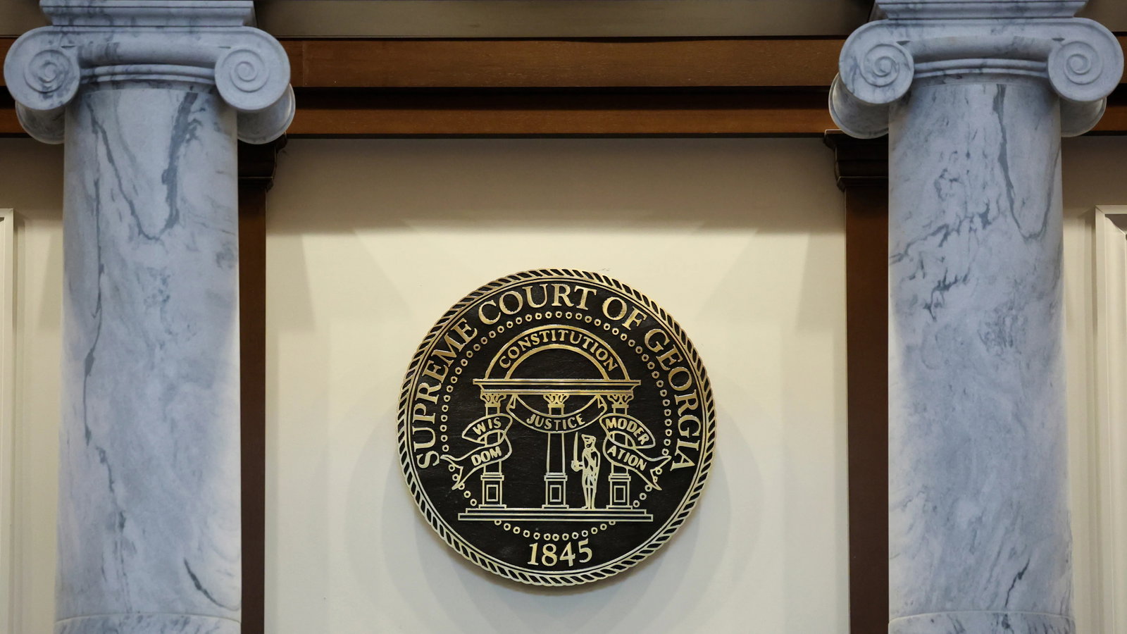 The seal for the Georgia Supreme Court is shown during a hearing at the Nathan Deal Judicial Center in June.