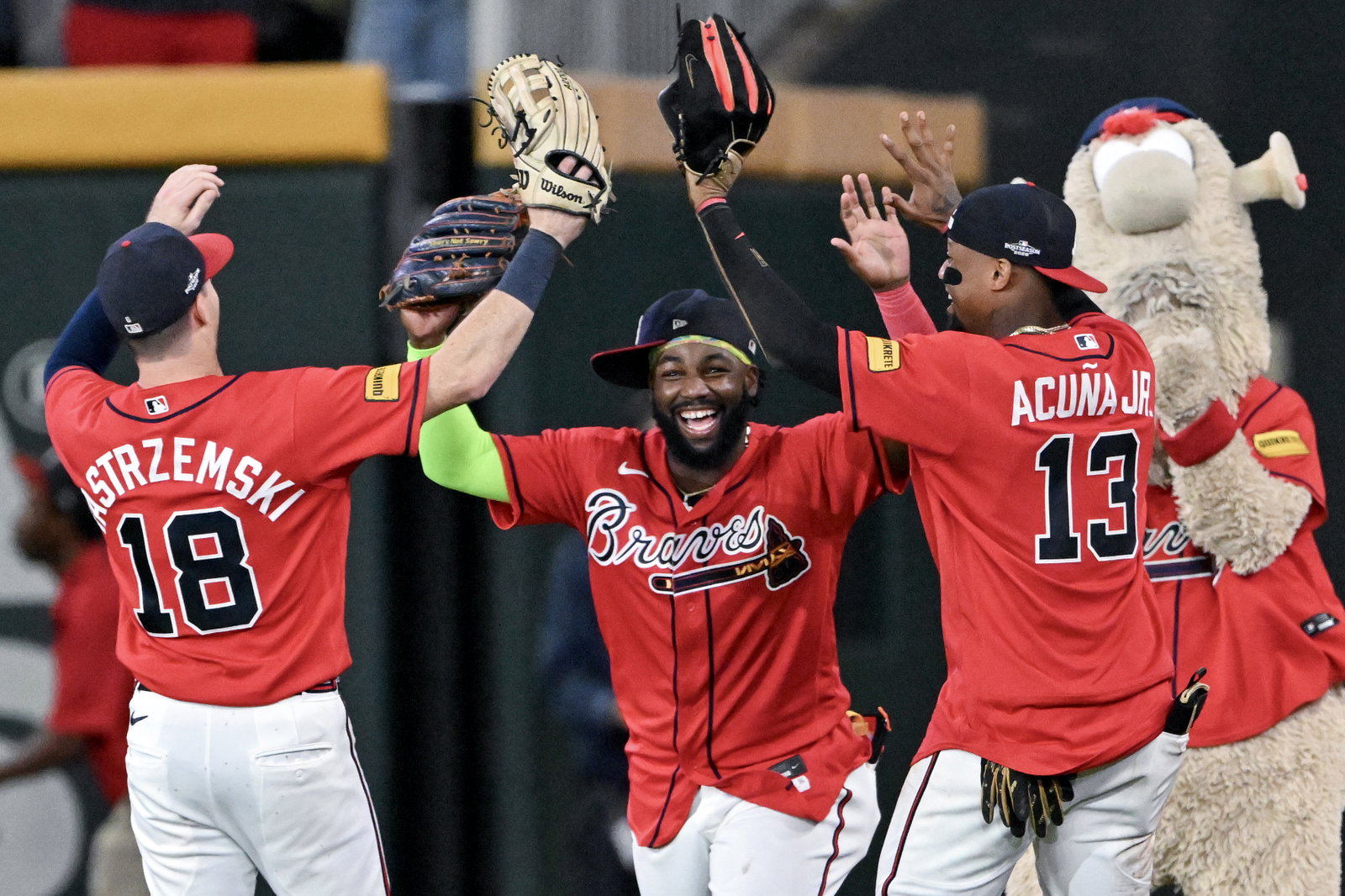 Braves outfielders Mike Yastrzemski (from left), Michael Harris II and Ronald Acuña Jr. celebrate after defeating the Philadelphia Phillies.