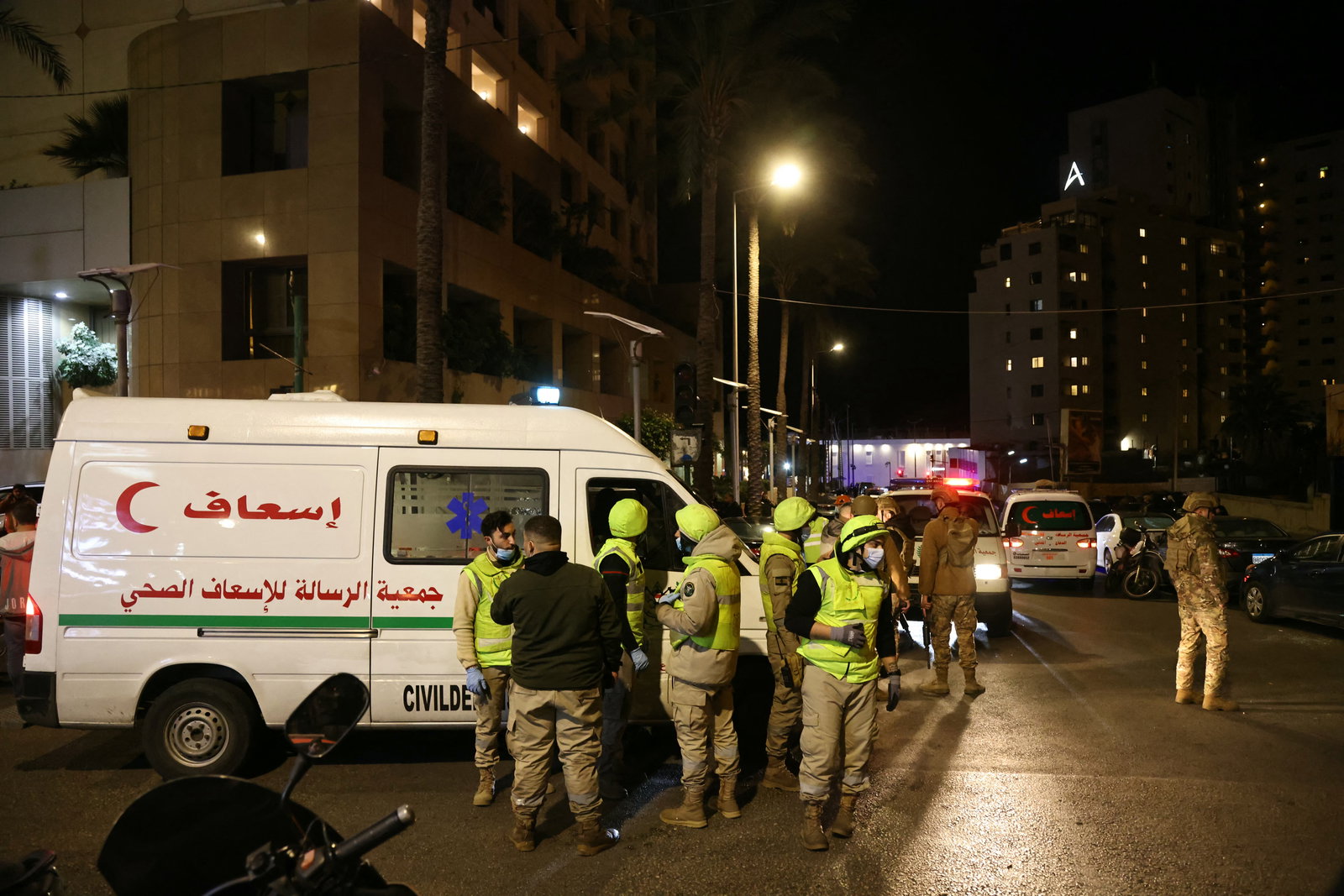 First aid responders gather at a Ramada hotel that was targeted by an Israeli strike, in Beirut