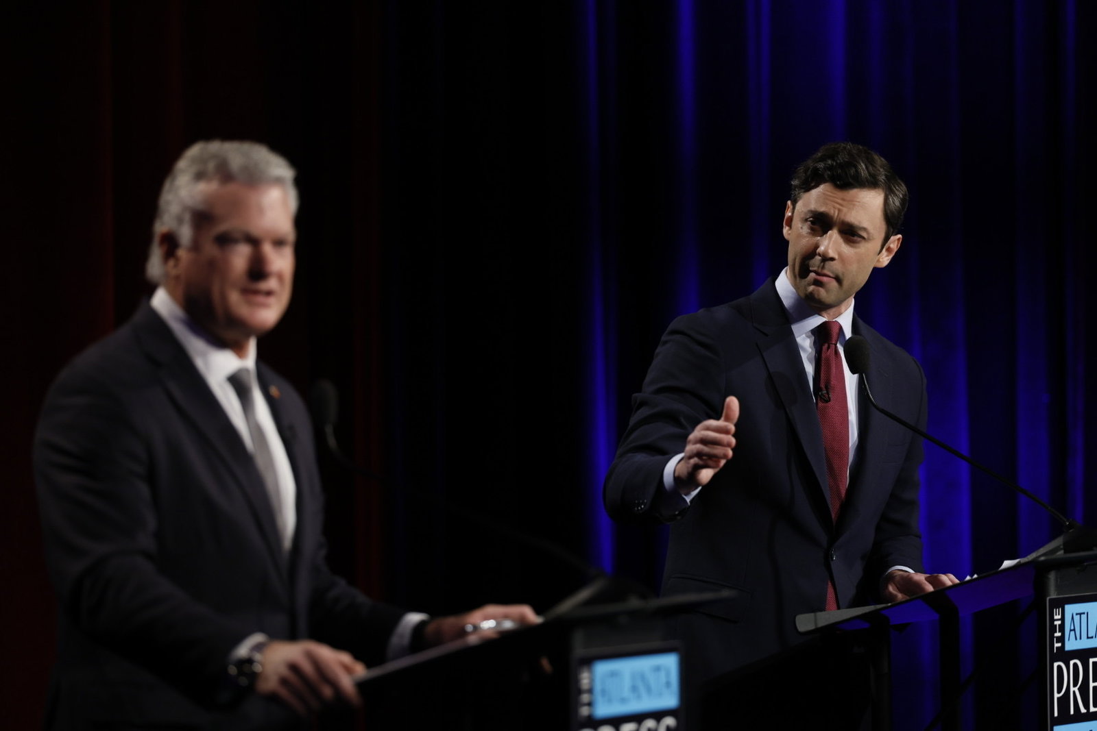 Republican U.S. Rep. Mike Collins (left) debates incumbent Democratic U.S. Sen Jon Ossoff during the Atlanta Press Club's Loudermilk-Young debate series Tuesday night.